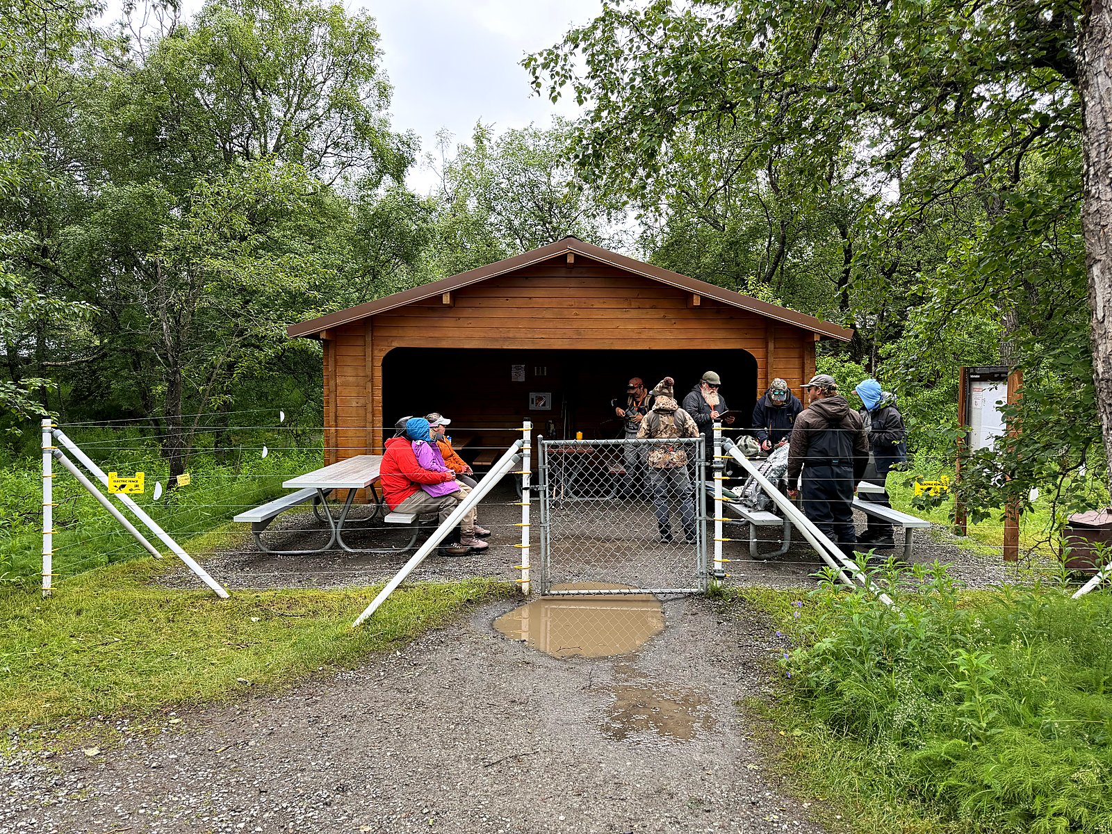 The fenced picnic shelter at Brooks Camp surrounded by an electric fence